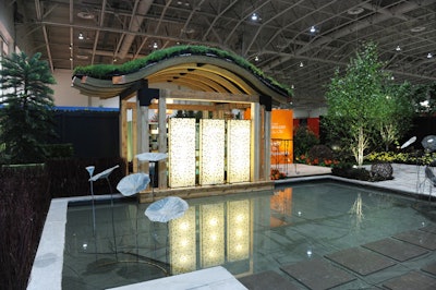 Landscape Ontario's exhibit opened into a display of local plants amid a shallow pool, canopy, and stonework.