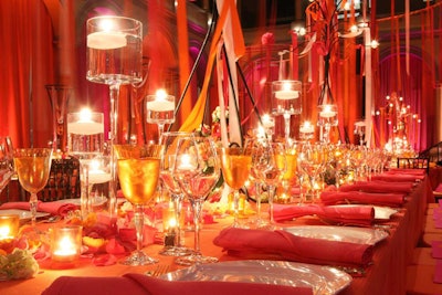 Larger tables were strewn with rose petals and floating candles in votives of different heights.
