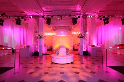 The tufted white banquette at the center of the downstairs space was later removed to make room for the near-capacity crowd.