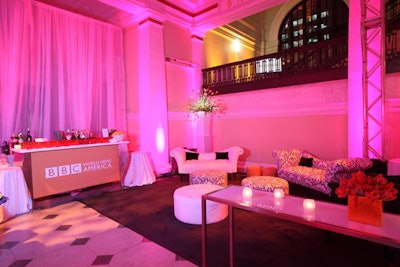 The decor included pink lighting and tangerine-colored bars downstairs.
