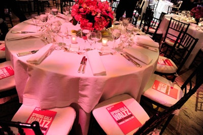 Matching the formal dress code and the invitation's colors, the tables were dressed in black and white with bright pink floral arrangements for a pop of color.