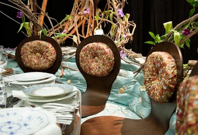 David Beahm's table for Continental Airlines had a banquette with two contrasting fabrics and wooden seats.