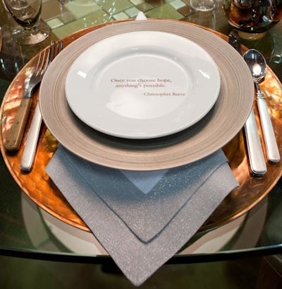 Architectural Digest's table had plates with inspirational quotes from notable people such as Anne Frank and Christopher Reeve.