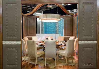 Moore & Giles stuck to a neutral palette when designing Architectural Digest's table. Elements included a chandelier, rug, and chairs in shades of beige.