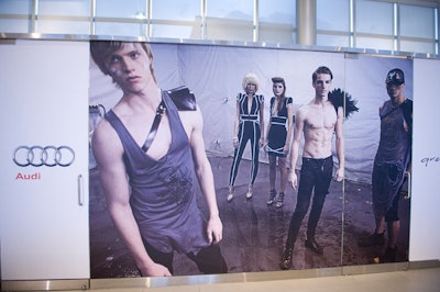 Images of models in Greta Constantine designs hung around the Audi showroom.