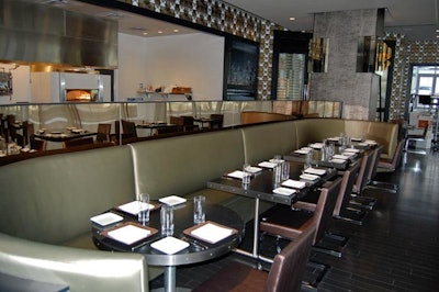 The main dining room houses an exhibition kitchen with a brick oven.