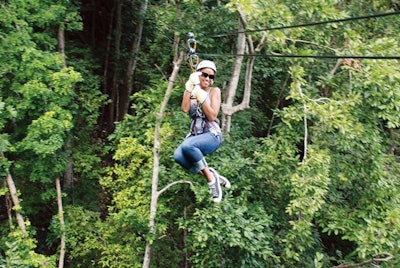 Guests on JetBlue’s Jamaica junket played on a zip line.