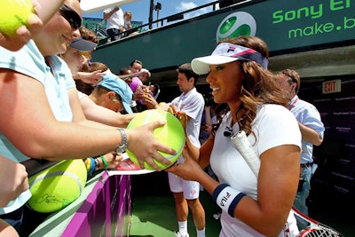 Mel B. signed autographs for fans before the match.