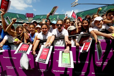 Students from local schools and community groups cheered for their favorite celebrity with cards showing red for Mel B. and green for Jay Sean.