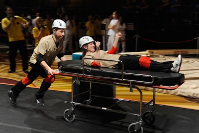 Participants sped down the course to pick up the next patient in the gurney race.