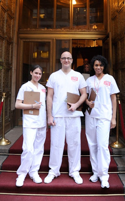 Workers wearing Nurse Jackie scrubs greeted guests.