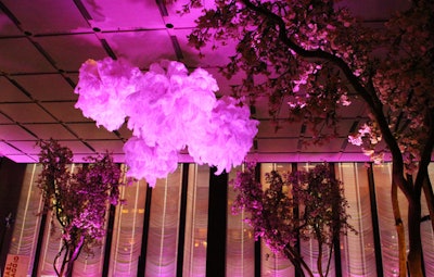 Tansey Design Associates created feathered centerpieces and hanging orbs.