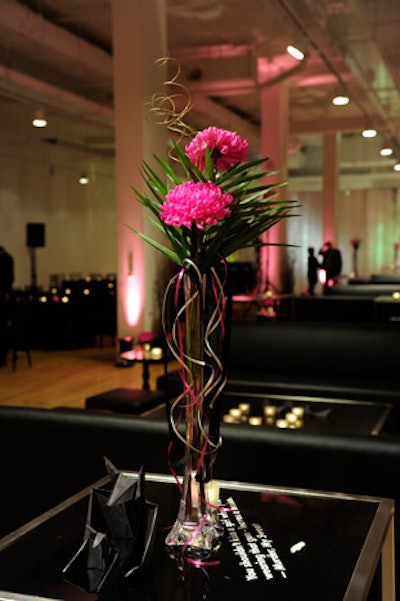 Hot pink blooms from Ellis Florals topped tables in the V.I.P. reception space.