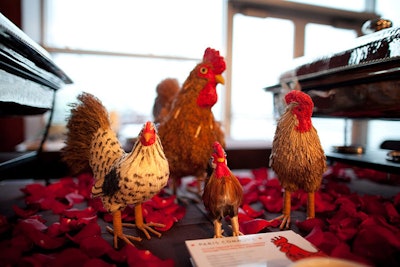 West Village restaurant Paris Commune decorated its catering station with red rose petals and figurines of its mascot, a red rooster.
