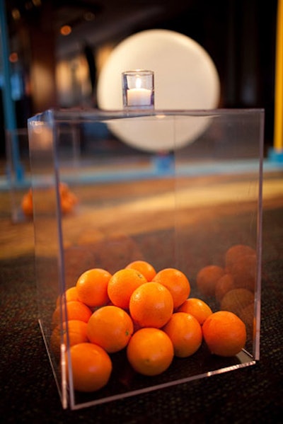 Circles found their way into much of the decor, including clear end tables filled with fresh oranges.