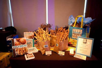 Amy's Bread decorated its station with baskets of breadsticks, its official cookbook, and information on catering services.