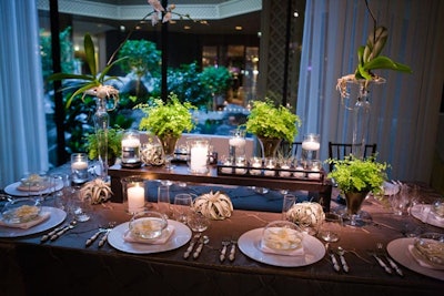 Instead of creating one focal point, Lee said she employed 'individual elements' such as maidenhair ferns, air plants, and floating gardenias to create a 'luxe garden' look for one of the tables.