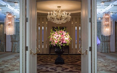 Heffernan Morgan used fresh-cut hydrangeas, peonies, and belles of Ireland in an oversize floral arrangement that stood outside the ballroom.