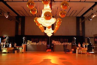 Gold disco balls and crystal chandeliers hang above the dance floor in the Fashion Environment, a 20,000-square-foot space in the Allstream Centre ballroom.