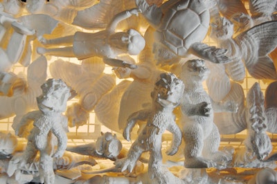 Jason Stroud of the design firm Stroudfoot Inc. used 150 Japanese monster toys, known as kaiju, to create the chandelier in the semiprivate dining room.