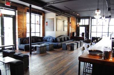 The flooring features reclaimed barn board from the Cambridge area and the DJ booth, near the front window, was constructed from the building's original support columns.