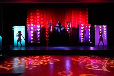 As guests entered the main ballroom, dancers performed behind shadow boxes before heading to the stage with venue staffers and volunteers for a choreographed performance to 'I Gotta Feeling' by the Black Eyed Peas.