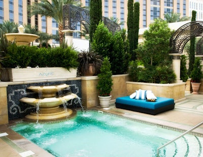 Azure attempts to channel the French Riviera with plush daybeds and striped throw pillows.