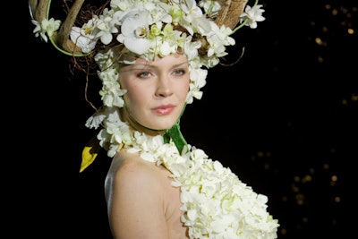 Christine Noelle Design and Dilly Lily used white orchids and branches in their collaborative design.