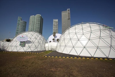 Inside the Heineken Dome Experience, one of four new arenas at Ultra, green lighting and Heineken video projections on the ceilings gave guests an unconventional concert experience during consecutive DJ performances throughout the two-day event.