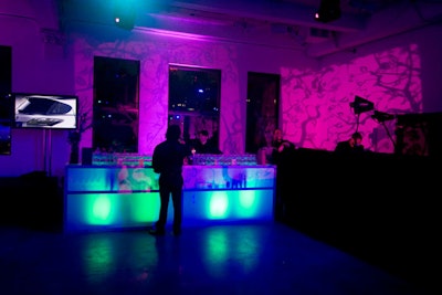 Leaf-patterned projections flooded the venue while color-changing lights accentuated the bars serving cocktails from sponsor Patron.