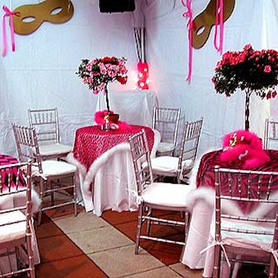The cocktail tables under the tent erected in the museum's garden featured animal print tablecloths trimmed with marabou.
