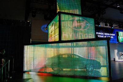 Hyundai hinted at its presentation with a semitransparent LED curtain that surrounded one of its new models.