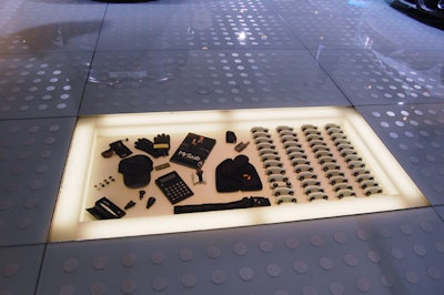 Saab embedded some of the accessories that come in the glove compartments of its cars in the illuminated floor of its booth.