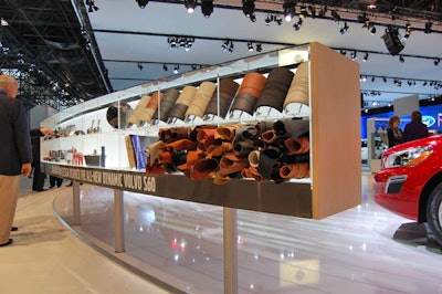 Volvo constructed its new booth like a dealership, with samples of different fabrics, colors, and finishes available in all of its models.