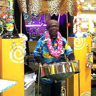 A steel drum player played inside the trade show booth, giving it a relaxing, festive environment.