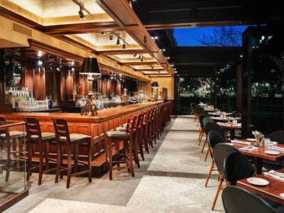 A retractable roof makes sidewalk dining possible year round.