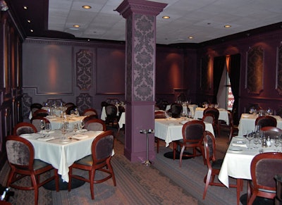 Servers circulate with a rolling champagne cart in a private dining room with seating for 40 to 50.