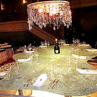 Karim Rashid's dazzling Swarovski table needed no ornamentation: The oblong, crystal-encrusted table with an equally stunning chandelier dripping with more crystals was a shimmery standout.