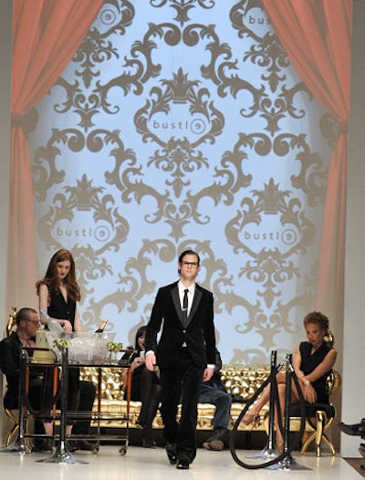 Shawn Hewson and Ruth Promislow, the pair behind Bustle Clothing, created a V.I.P. scene on the runway for their show, entitled Behind the Velvet Rope. Model Stacey McKenzie, Fashion Television's Jeanne Beker, designer Evan Biddell, and hair stylist Jie Matar participated in presentation.