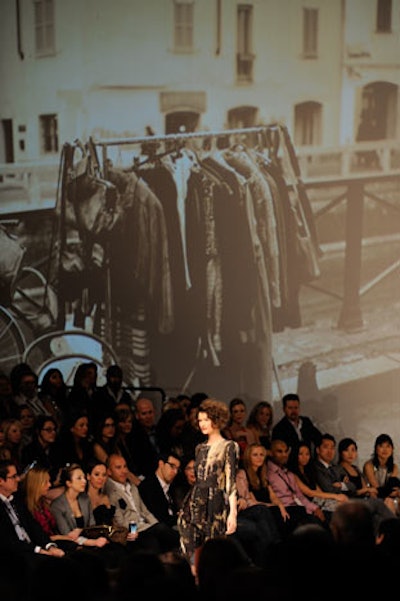 Black and white images of clothing hanging on racks provided a backdrop for the Comrags show, featuring fashions from designers Joyce Gunhouse and Judy Cornish.