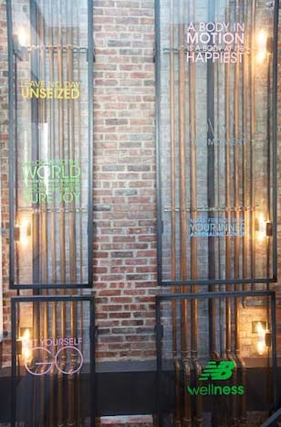 Lines from New Balance's Wellness manifesto were stuck to glass and mirrors in the venue.