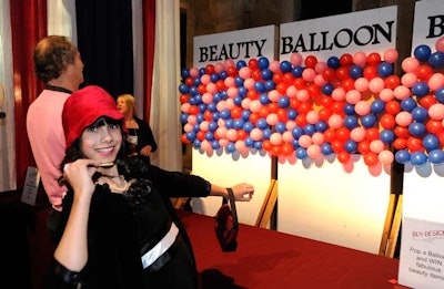 For $20, attendees had the opportunity to pop a balloon with a dart to win a prize at the Beauty Balloon Buster game.