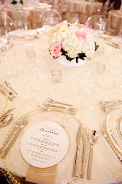 Florals from Teatro Verde topped dining tables, and each place setting included a menu card listing the courses prepared by chef Mark McEwan.