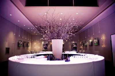 A tall vase filled with cherry blossoms sat in the middle of a circular bar in the venue's Sky Room, where organizers hosted a V.I.P. reception.