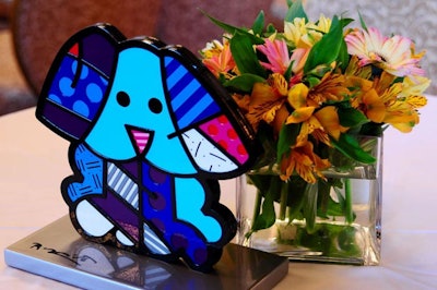 Romero Britto provided his colorful sculptures for centerpieces on each of the tables at the end of the runway.