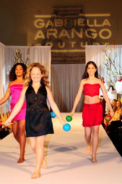 Three young girls shaking maracas transitioned the event from the dance performance to the fashion show.