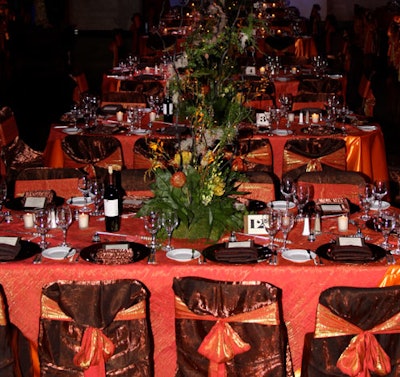 Connie Duglin Specialty Linen provided burnt orange and copper tablecloths and chair covers for the dinner tables.