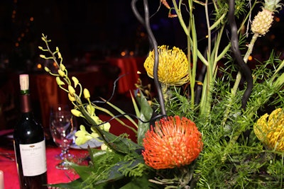 Rainbow Flowers used tropical flowers and foliage to create the centerpieces.