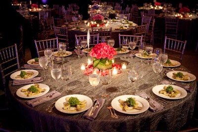 Roses topped platinum-clothed tables.