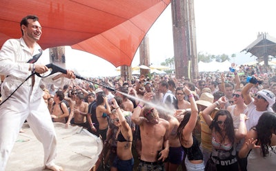 Spraying water cooled crowds, though the event's heat was less punishing than in previous years.